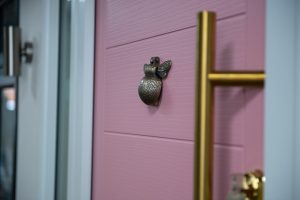 Pink front door with bee knocker