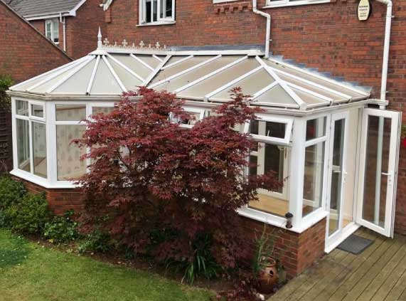 a before shot of a conservatory tiled roof