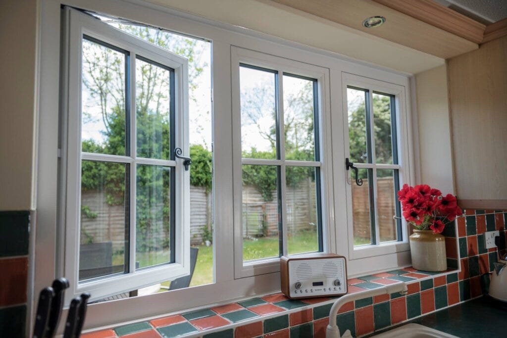 close up of georgian style uPVC window with one sash open.