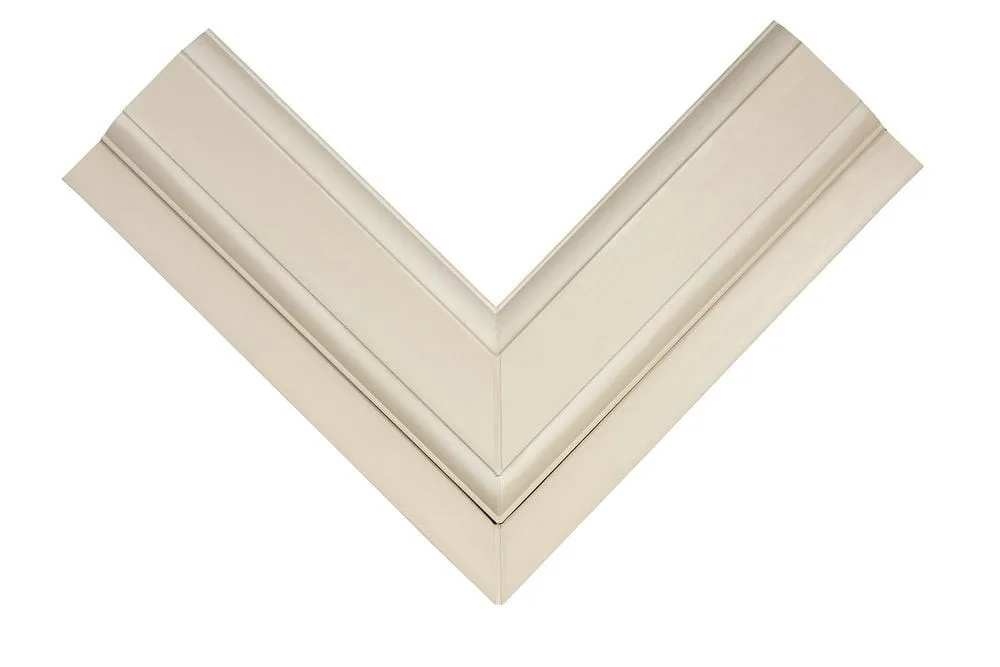 Close-up of a window or door frame corner section in Cream finish, showing the stepped profile detail.